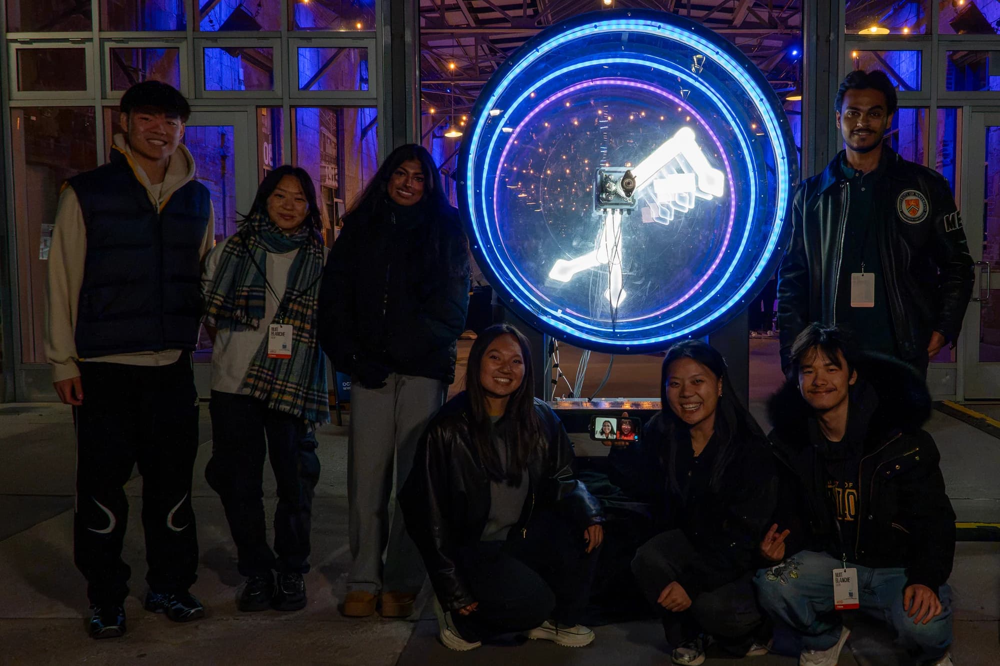 The Prism Collective team gathered around Rhythms of Chaos at the exhibition
